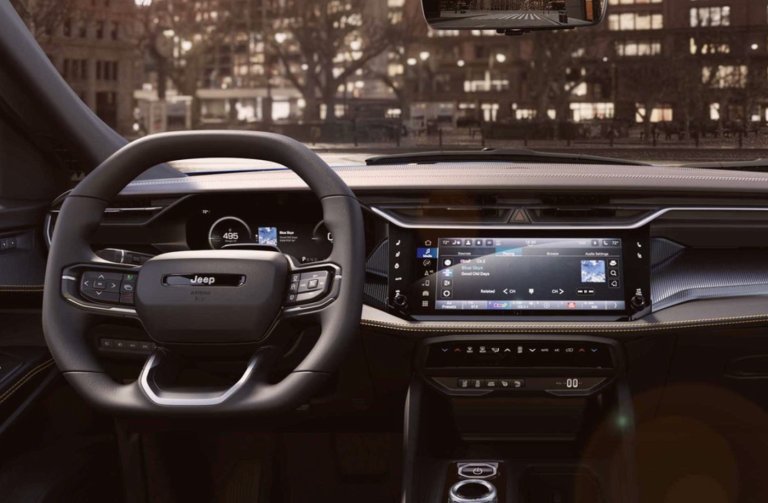interior view of steering wheel and infotainment screen of 2026 jeep cherokee